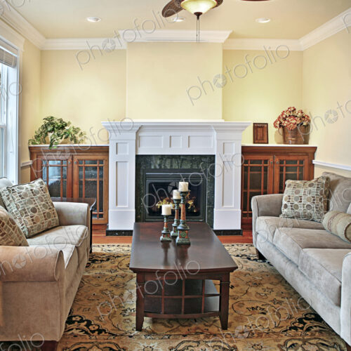Sofa and loveseat near fireplace in livingroom