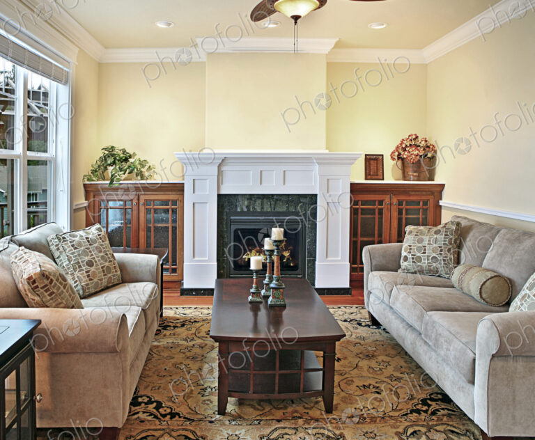 Sofa and loveseat near fireplace in livingroom