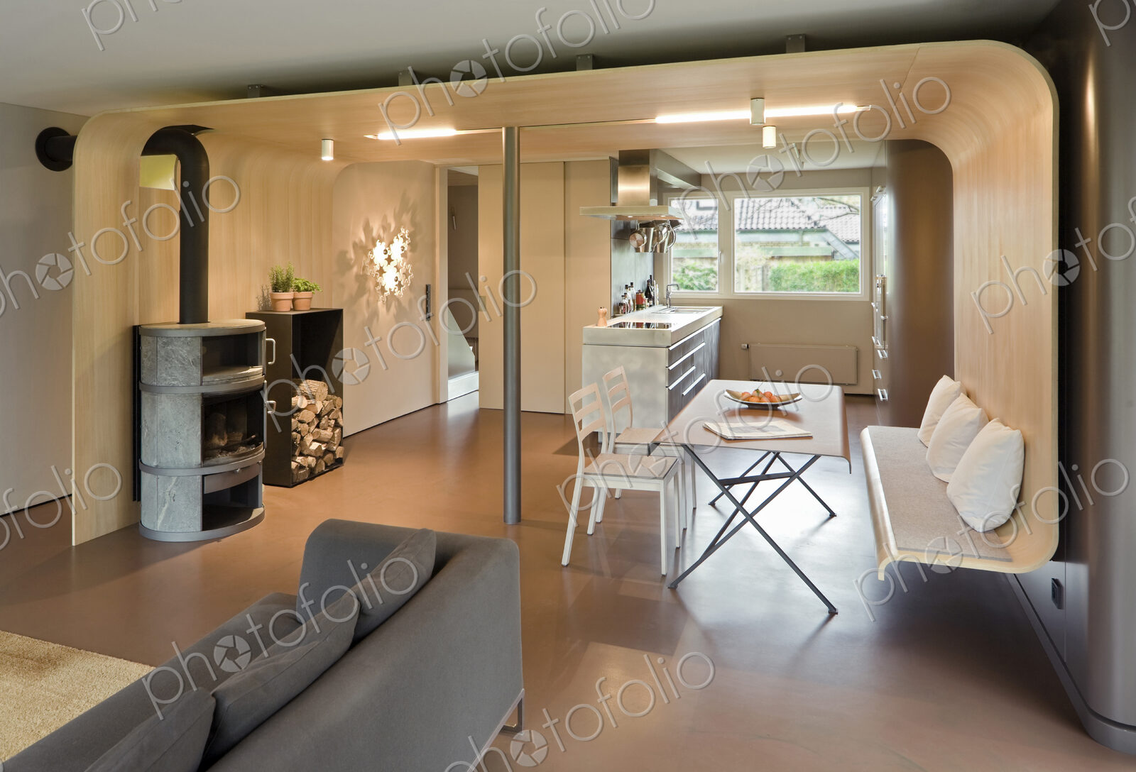 Sofa, dining table and chairs in modern home