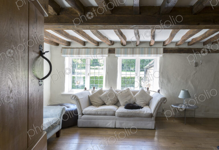 Sofa under beams in living room