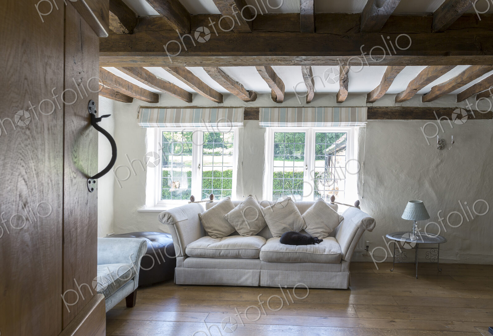 Sofa under beams in living room