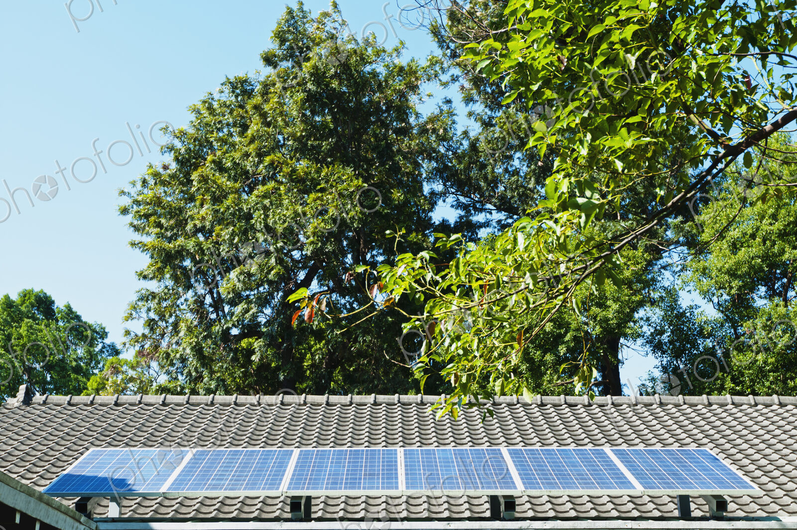 Solar energy panels on a traditional Chinese roof. Providing stored solar green energy,