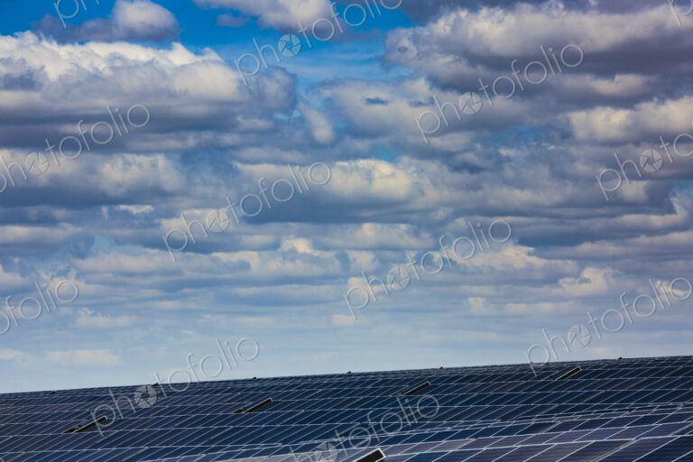 Solar farm, Lind, ranks of solar panels on a hillside.