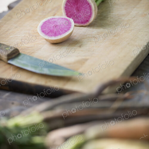 Sorting and chopping freshly picked summer vegetables and fruits.
