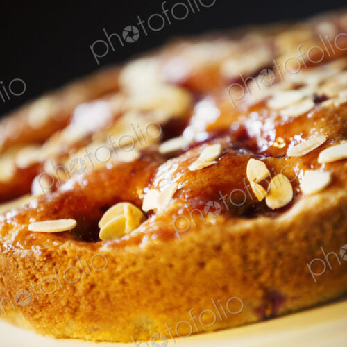 Specialist coffee shop. A fresh baked tart with almonds on the top. Specialist coffee shop. A fresh baked tart with almonds on the top.