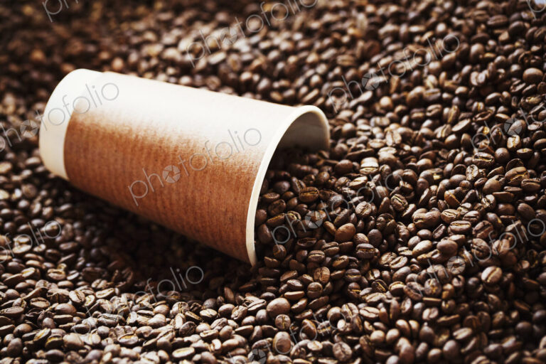 Specialist coffee shop. A sack of roasted beans and a cardboard cup.