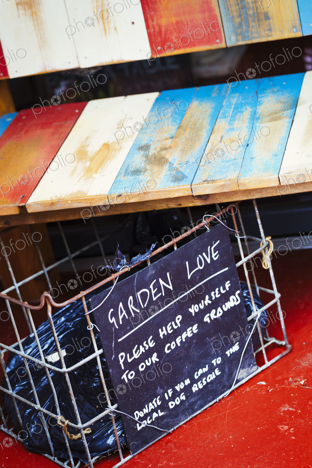 Specialist coffee shop. A wooden shelf and a container with a sign suggesting clients…