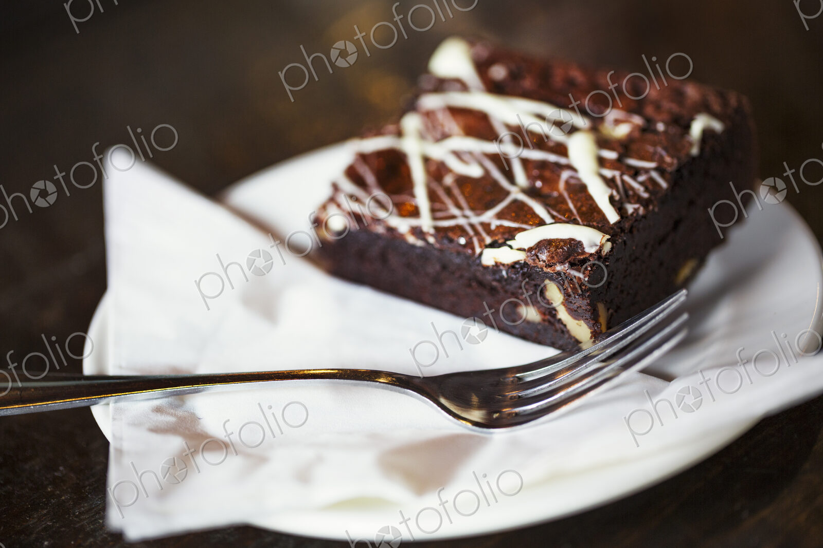 Specialist coffee shop. An iced chocolate brownie on a plate.