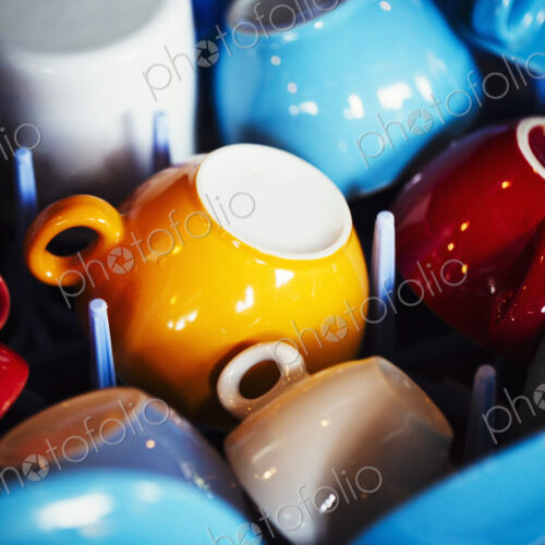 Specialist coffee shop. Coloured coffee cups placed upside down. Specialist coffee shop. Coloured coffee cups placed upside down.