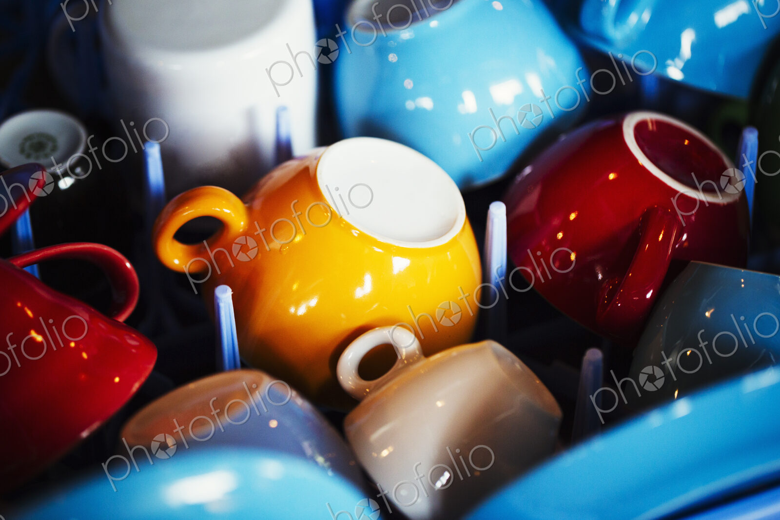 Specialist coffee shop. Coloured coffee cups placed upside down.