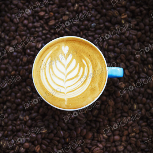 Specialist coffee shop. View from above of a cup of coffee with a complex pretty fern… Specialist coffee shop. View from above of a cup of coffee with a complex pretty fern…