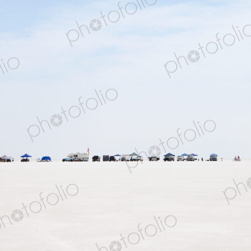 Spectators lined up on Bonneville Salt Flats during Speed Week Spectators lined up on Bonneville Salt Flats during Speed Week