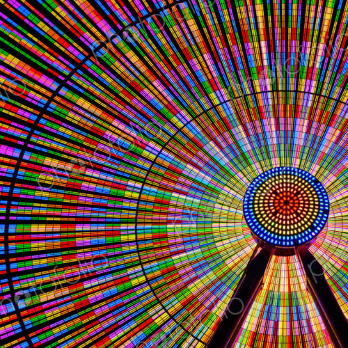 Spinning ferris wheel illuminated at night