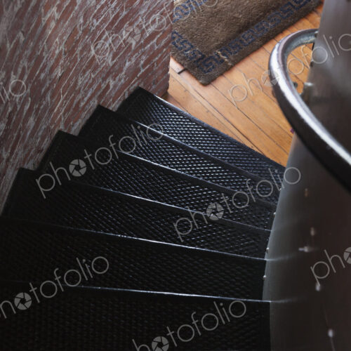 Spiral stairs, a staircase with a railing twisting and turning in a small space, a… Spiral stairs, a staircase with a railing twisting and turning in a small space, a…