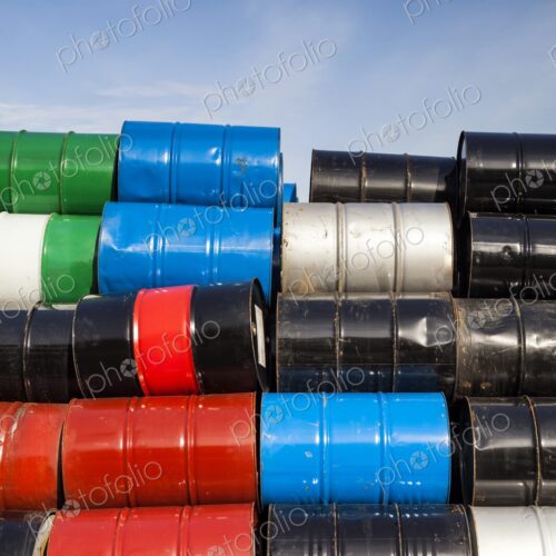 Stack of colorful petroleum barrels against a blue sky, Portland, Oregon Stack of colorful petroleum barrels against a blue sky, Portland, Oregon