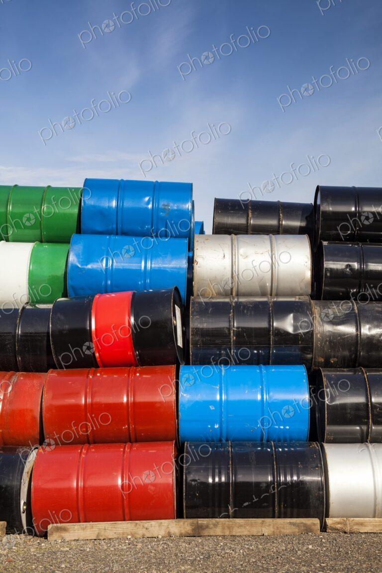 Stack of colorful petroleum barrels against a blue sky, Portland, Oregon