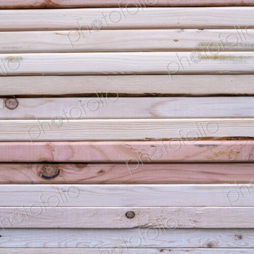 Stack of pine 2x4 lumber used for building construction Stack of pine 2x4 lumber used for building construction