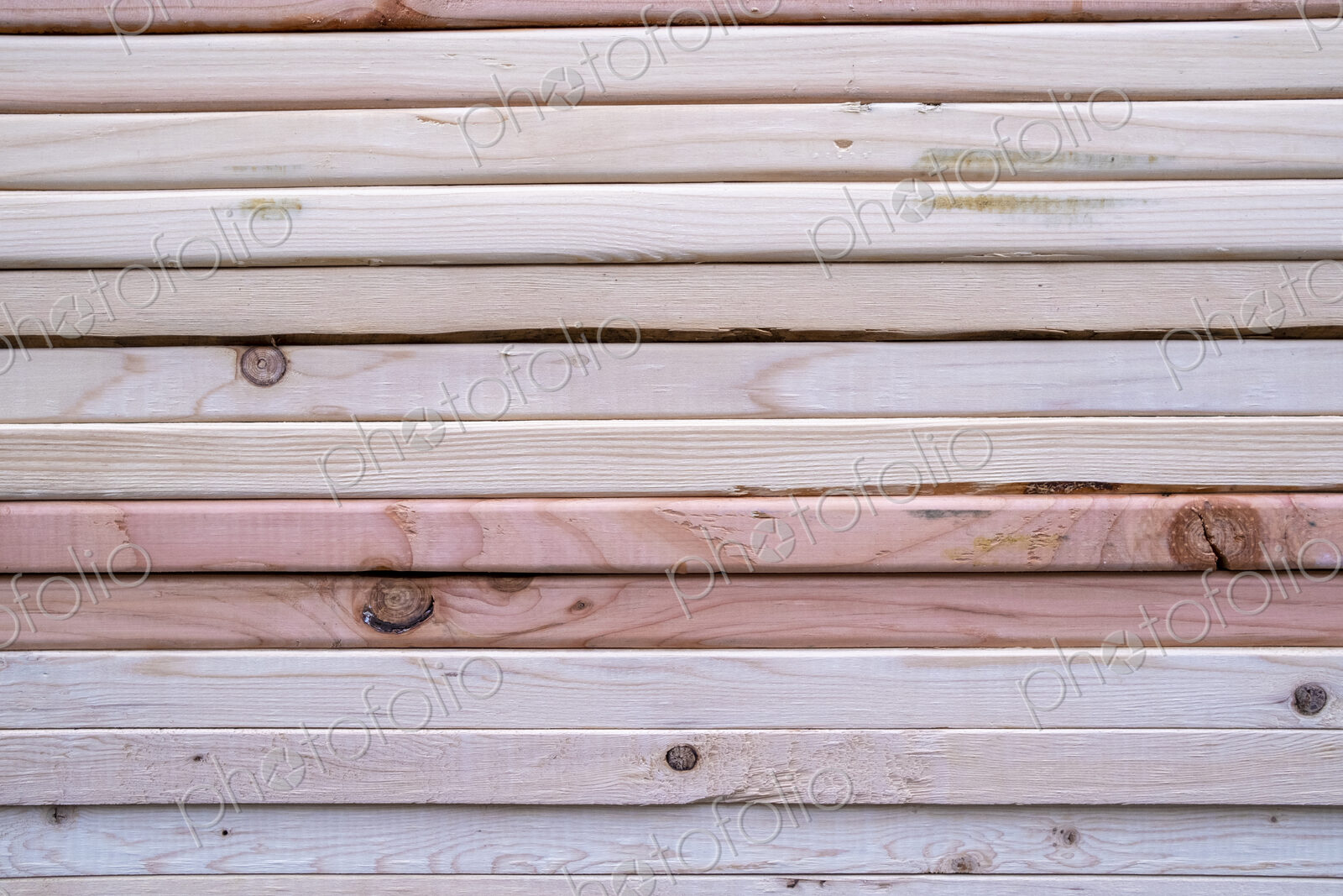 Stack of pine 2×4 lumber used for building construction