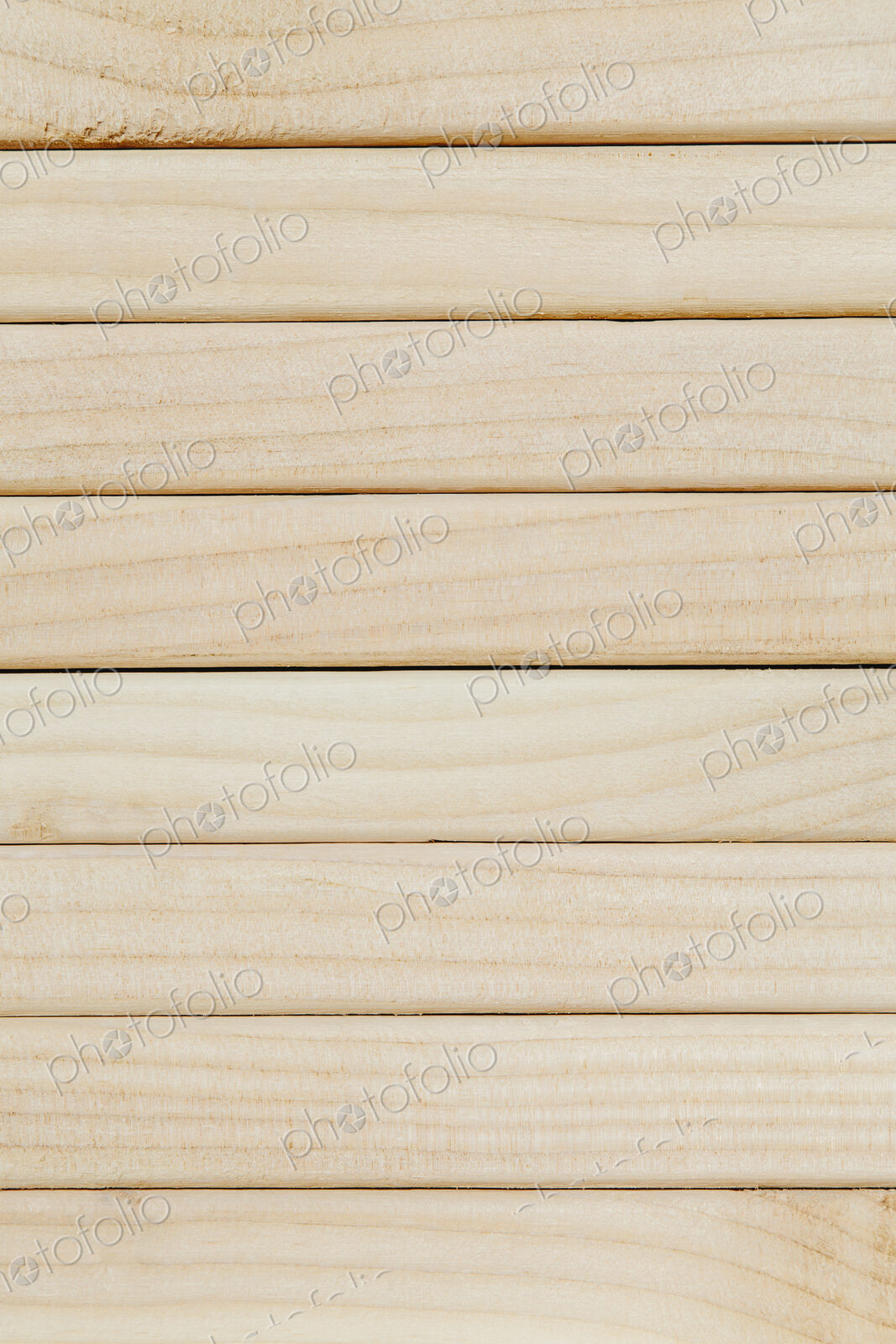 Stack of sawn prepared timber, spruce wood planks or studs, for use. Treated planed…