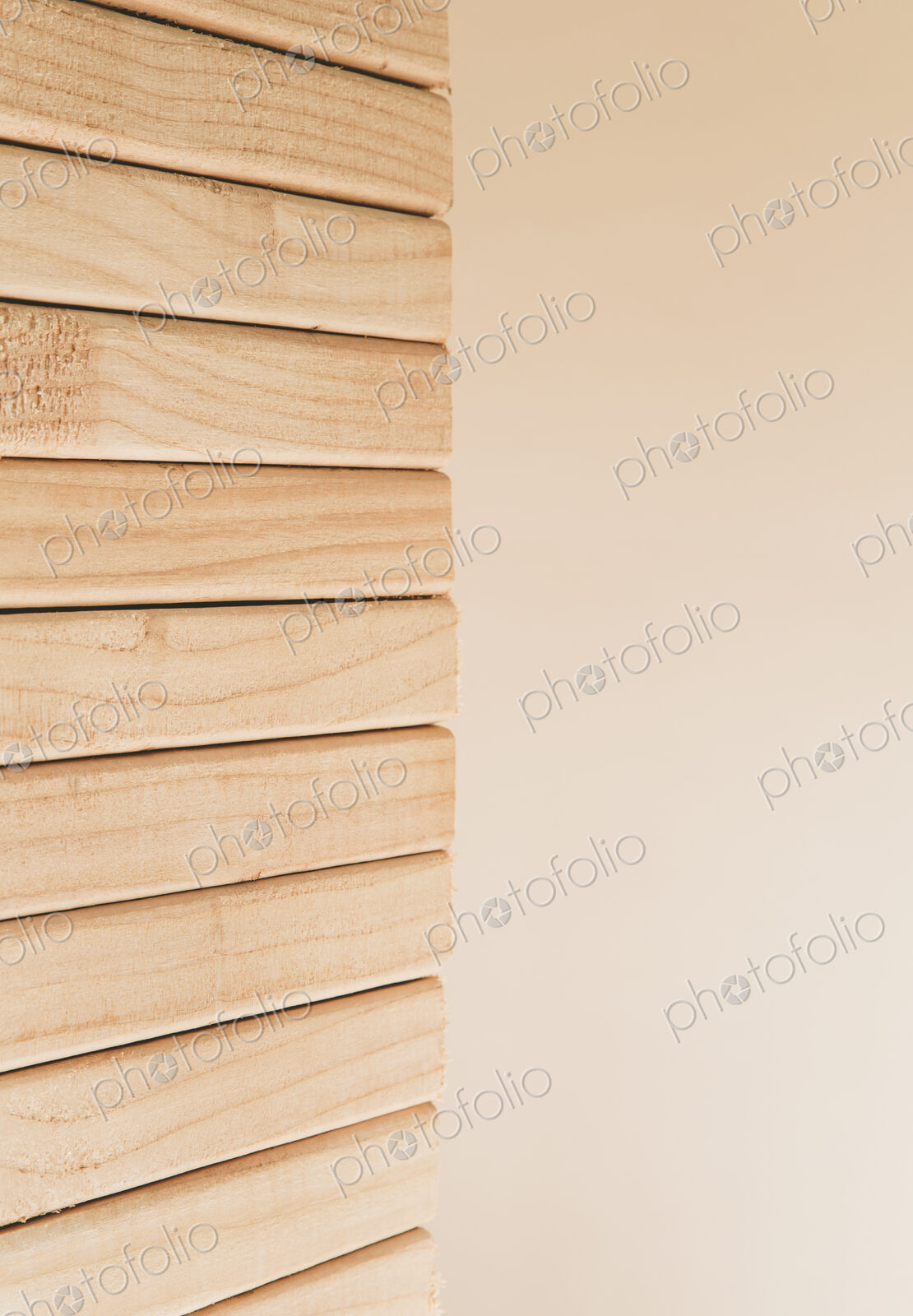 Stack of sawn prepared timber, spruce wood planks or studs, for use. Treated planed…