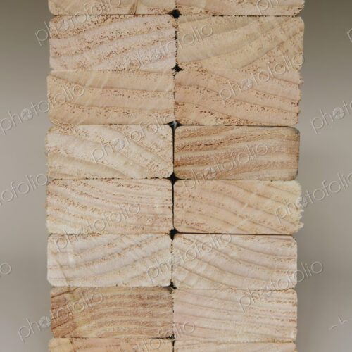 Stack of sawn prepared timber, spruce wood planks or studs, for use. Treated wood in… Stack of sawn prepared timber, spruce wood planks or studs, for use. Treated wood in…
