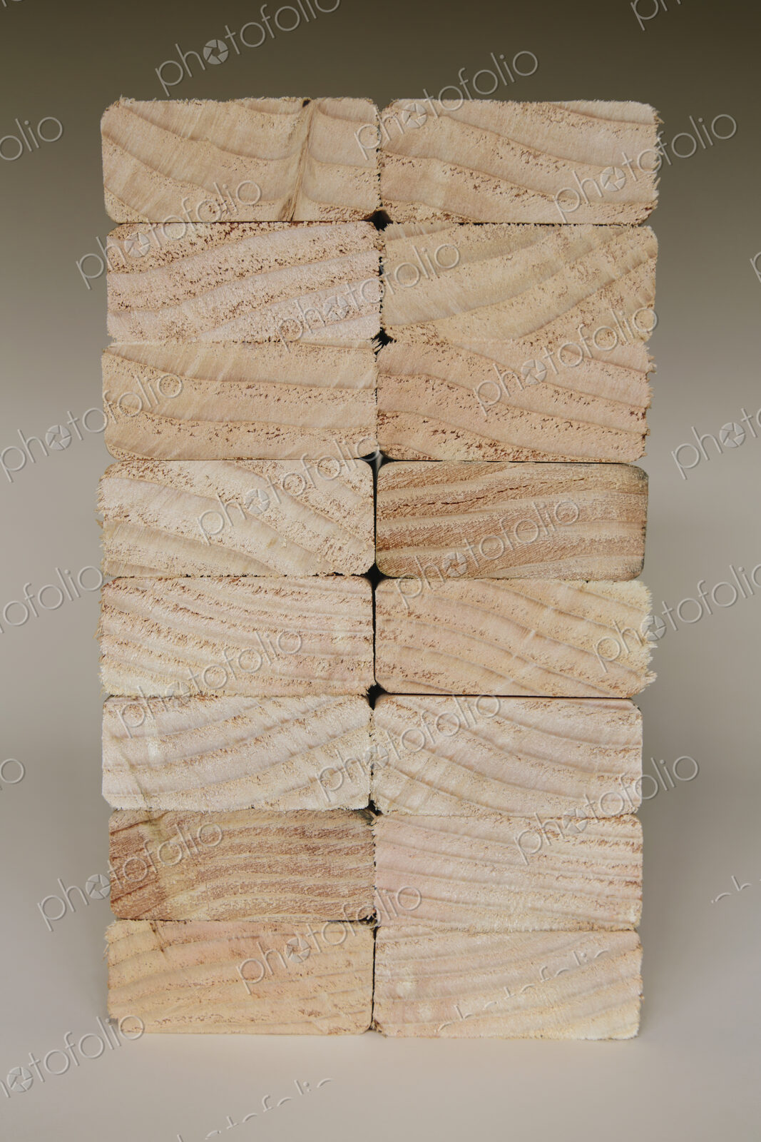 Stack of sawn prepared timber, spruce wood planks or studs, for use. Treated wood in…