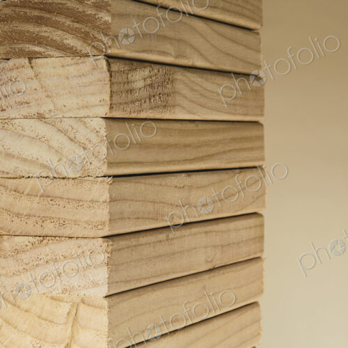 Stack of sawn prepared timber, spruce wood planks or studs, for use. Treated wood in… Stack of sawn prepared timber, spruce wood planks or studs, for use. Treated wood in…