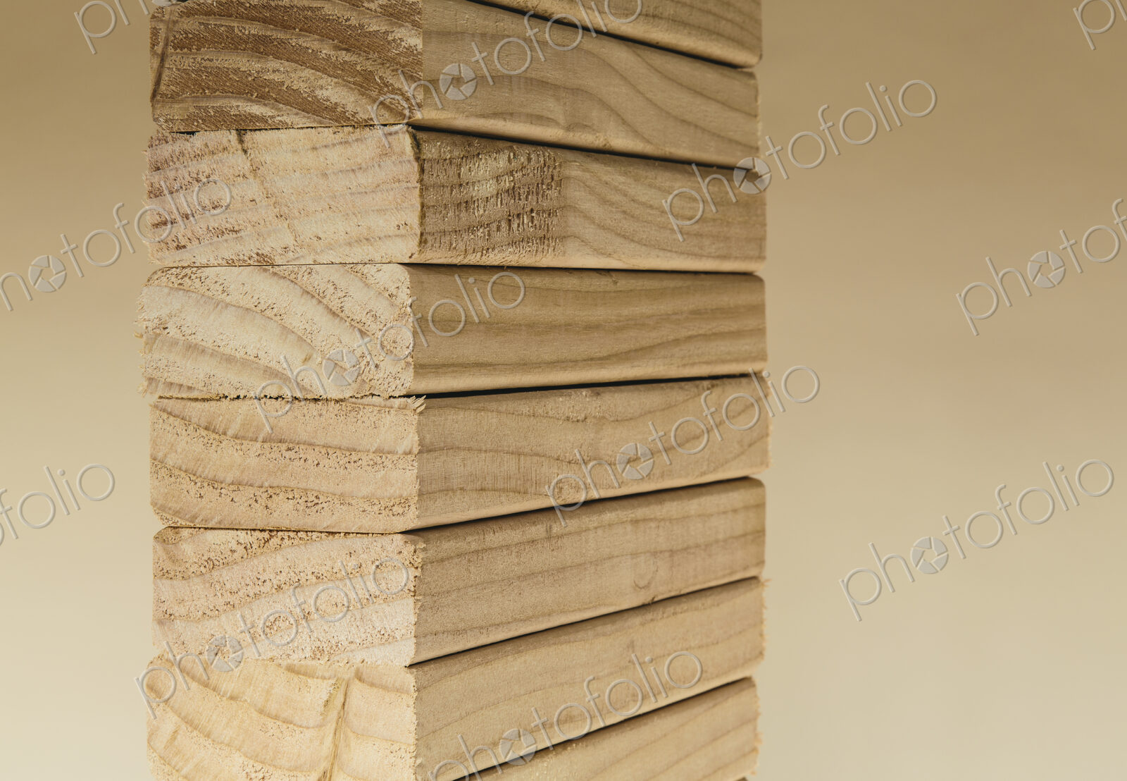 Stack of sawn prepared timber, spruce wood planks or studs, for use. Treated wood in…