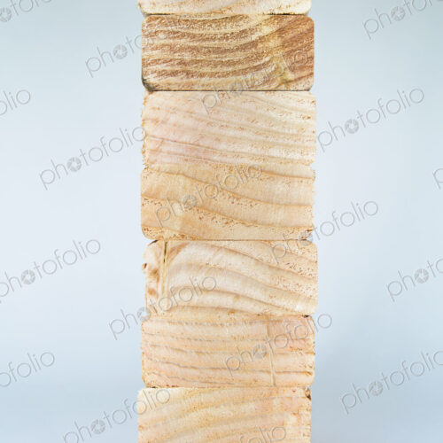 Stack of sawn prepared timber, spruce wood planks or studs, for use. Treated wood in… Stack of sawn prepared timber, spruce wood planks or studs, for use. Treated wood in…
