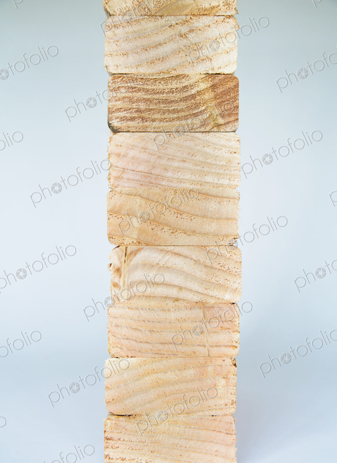 Stack of sawn prepared timber, spruce wood planks or studs, for use. Treated wood in…