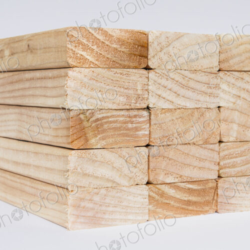 Stack of sawn prepared timber, spruce wood planks or studs, for use. Treated wood in… Stack of sawn prepared timber, spruce wood planks or studs, for use. Treated wood in…