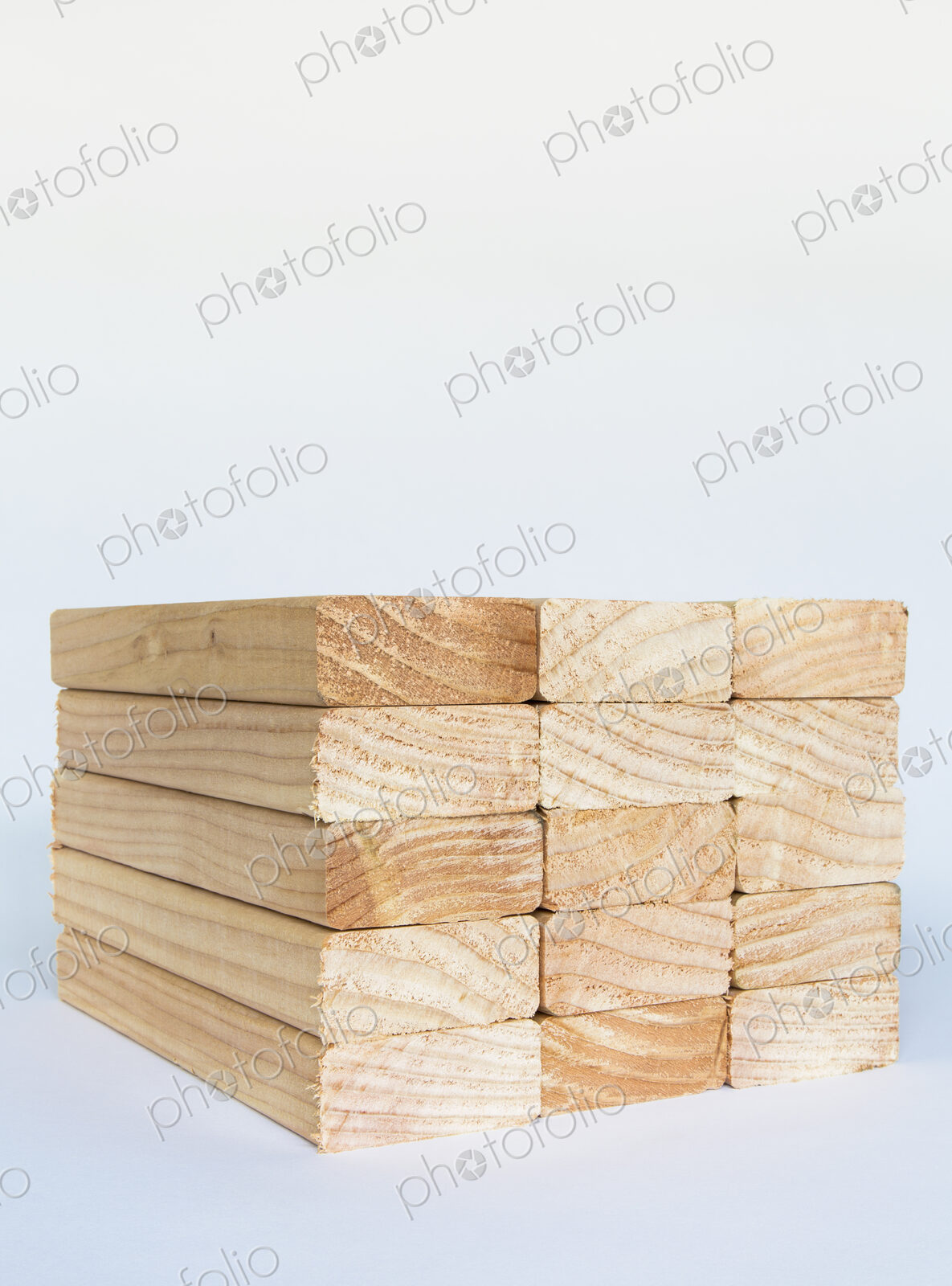 Stack of sawn prepared timber, spruce wood planks or studs, for use. Treated wood in…