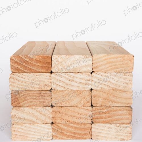 Stack of sawn prepared timber, spruce wood planks or studs, for use. Treated wood in… Stack of sawn prepared timber, spruce wood planks or studs, for use. Treated wood in…