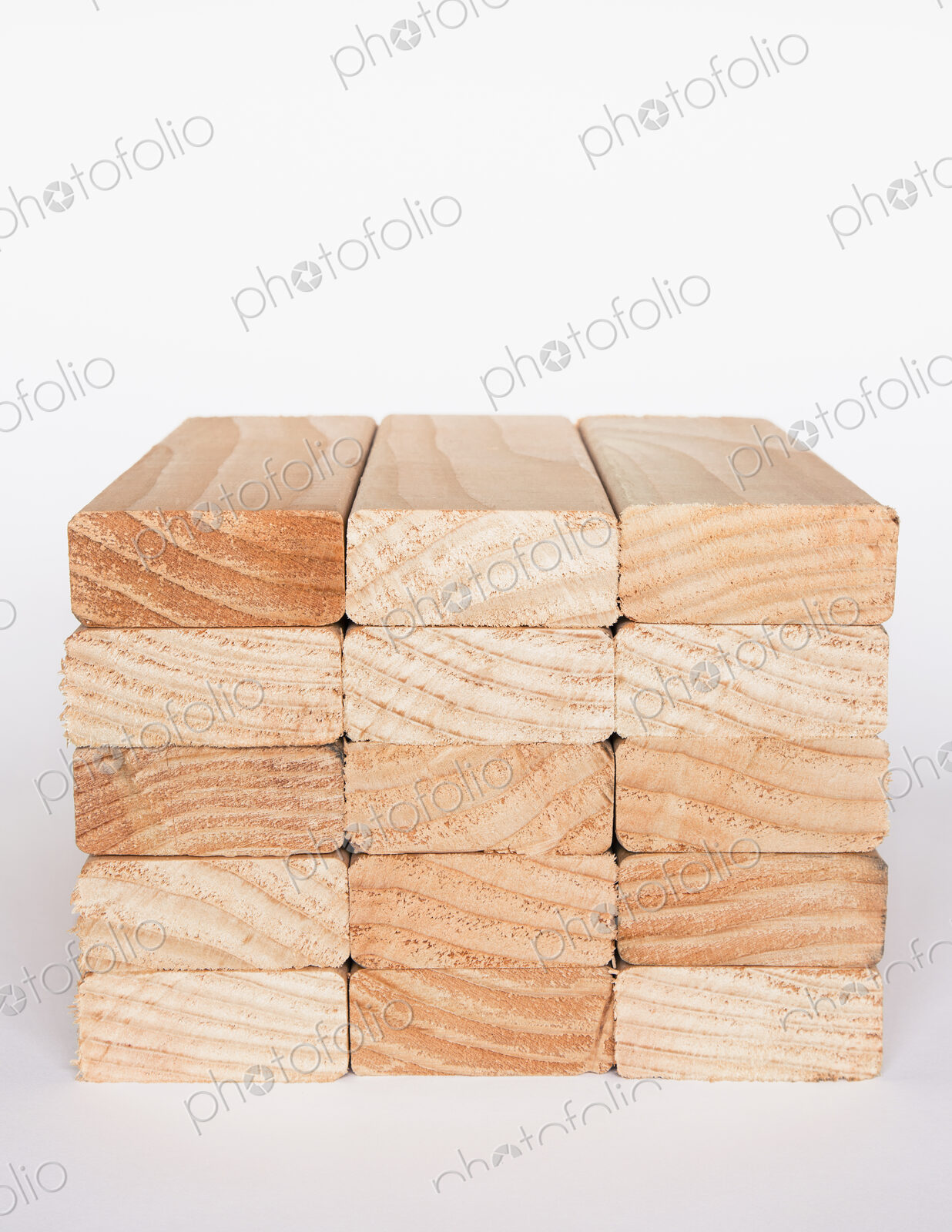 Stack of sawn prepared timber, spruce wood planks or studs, for use. Treated wood in…