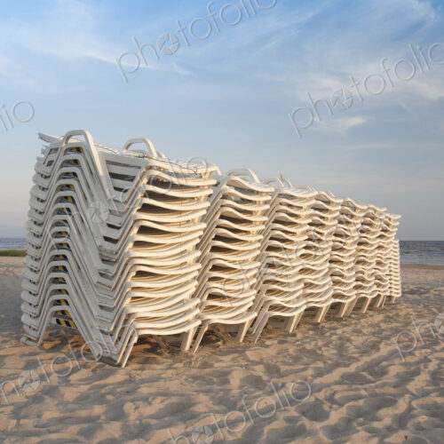 Stacked Lounge Chairs on a Beach Stacked Lounge Chairs on a Beach