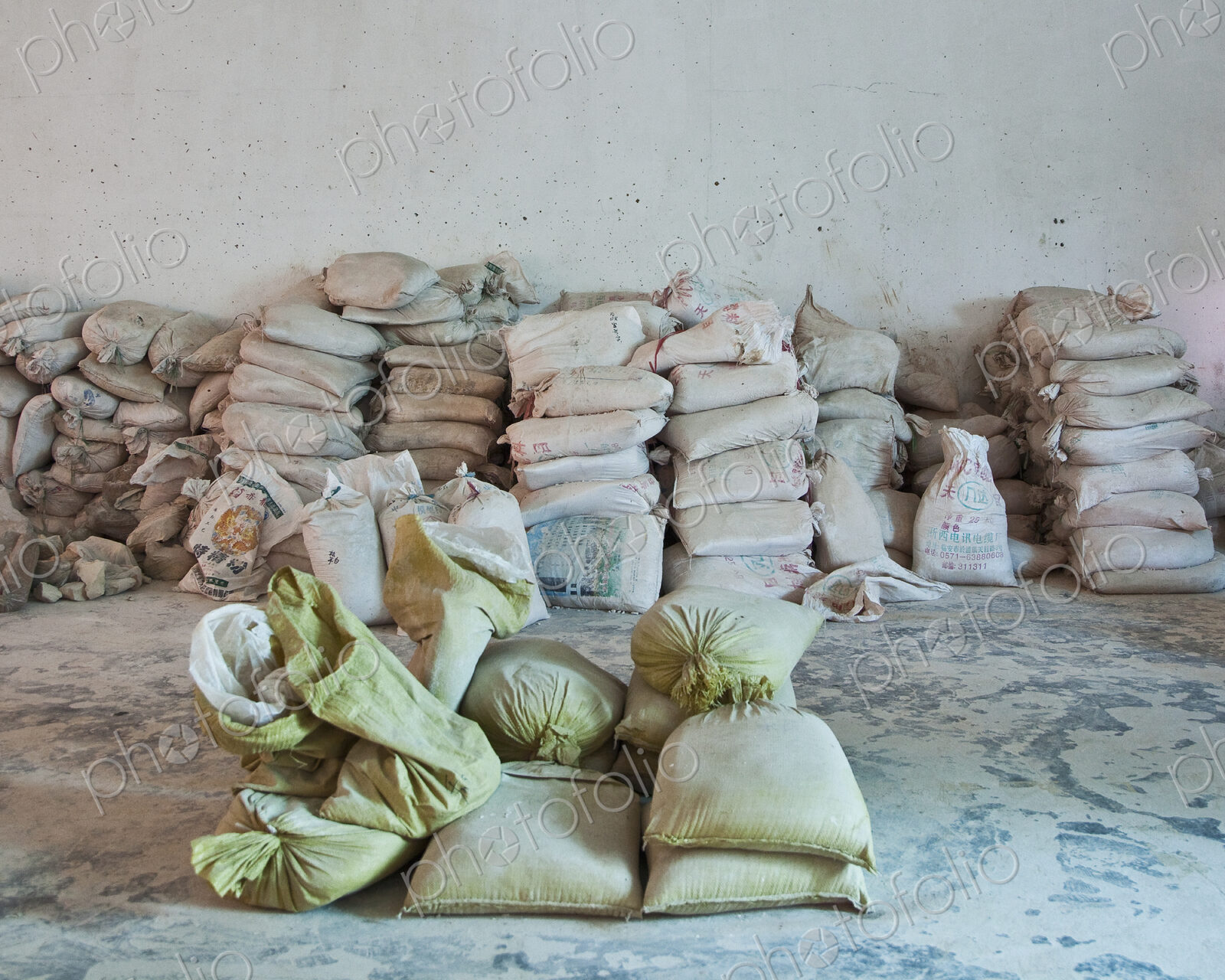 Stacked sacks of flour against a wall, storage