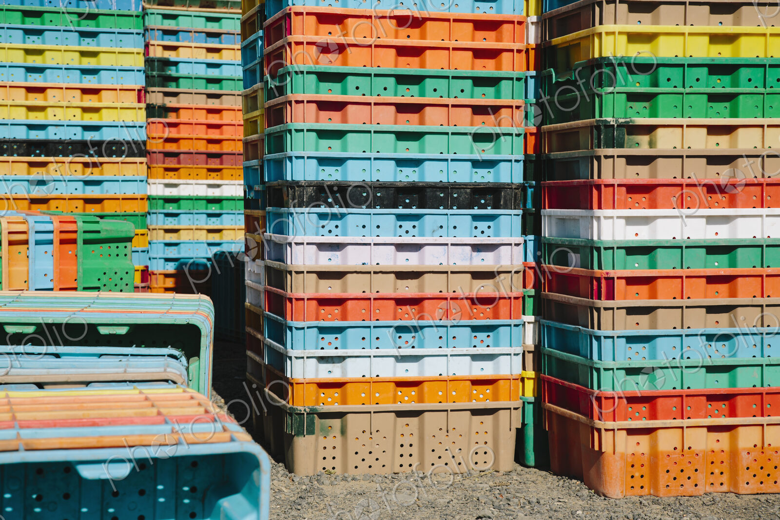 Stacks of multi-colored containers used for harvesting grapes