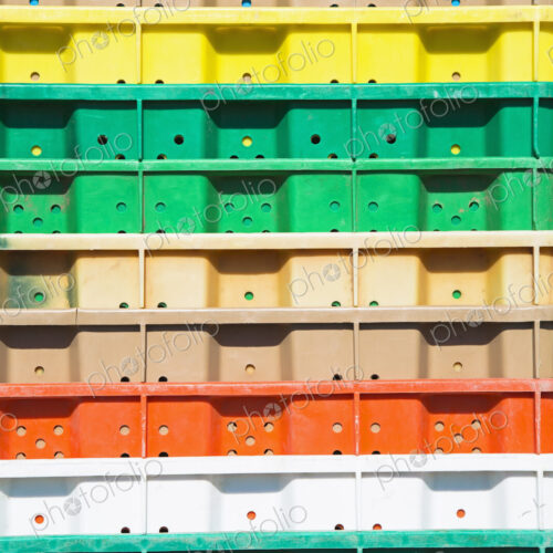 Stacks of multi-colored containers used for harvesting grapes