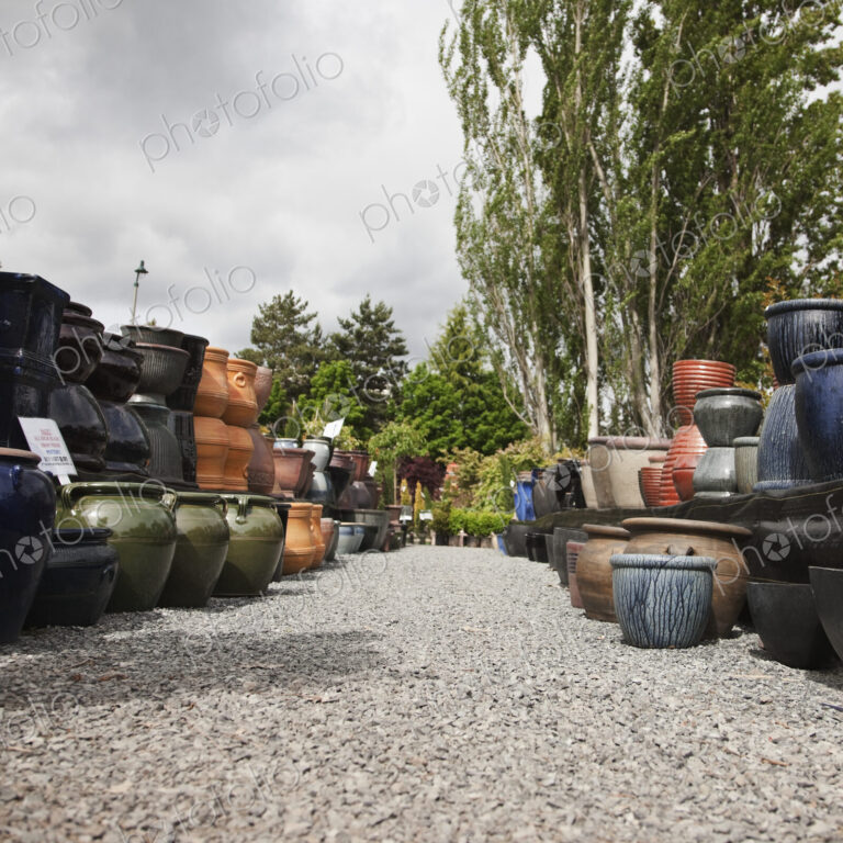 Stacks of pots in garden centre.