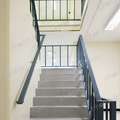 Stairwell with metal handrail.