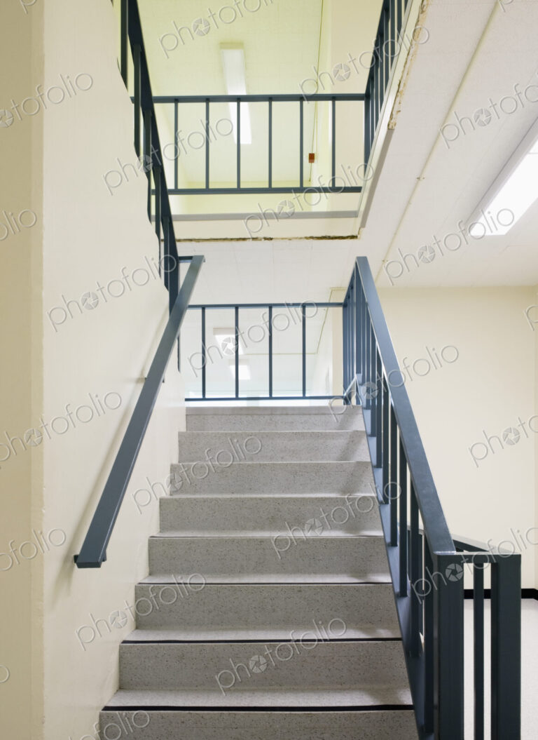 Stairwell with metal handrail.