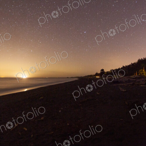 Star filled sky and the sun emerging on the horizon above Freshwater Bay, Port Angeles Star filled sky and the sun emerging on the horizon above Freshwater Bay, Port Angeles