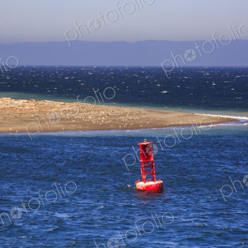 Starboard buoy in the sea off a sandspit at Ediz Hook Port Angeles. Starboard buoy in the sea off a sandspit at Ediz Hook Port Angeles.