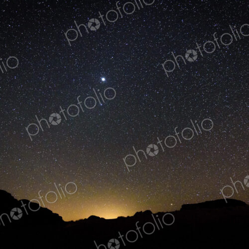 Stars across the sky in the Wadi Rum desert wilderness in southern Jordan at night.
