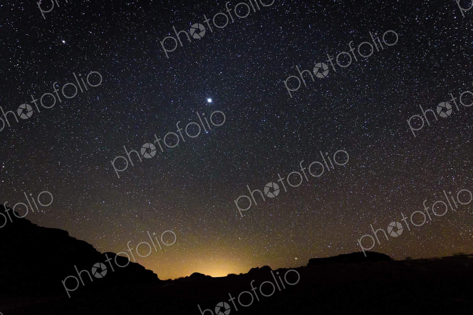 Stars across the sky in the Wadi Rum desert wilderness in southern Jordan at night.
