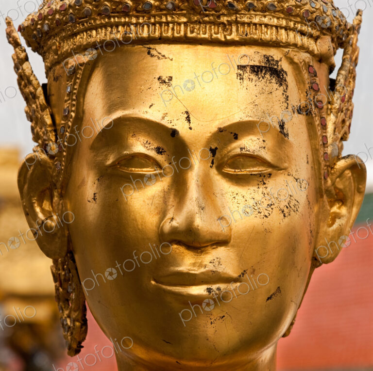 Statue face at the Grand Palace, Bangkok, Thailand