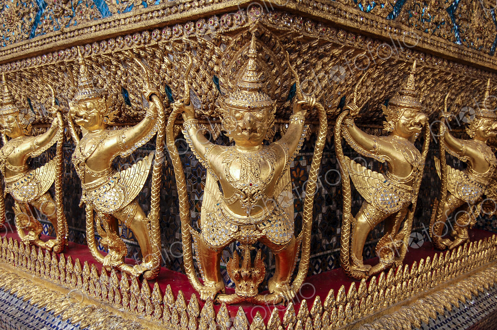 Statues frieze at the golden shrine at Wat Pho Buddhist temple