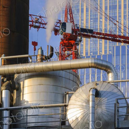 Steam from pipe near highrise