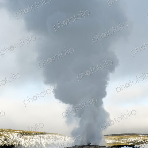 Steam rising from Old Faithful geyser, Yellowstone, Wyoming, United States Steam rising from Old Faithful geyser, Yellowstone, Wyoming, United States