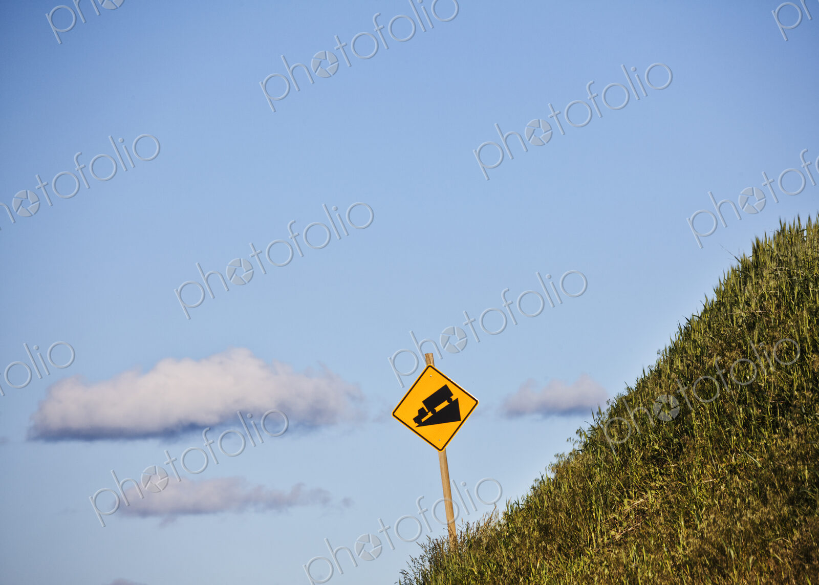 Steep grade caution sign for heavy trucks on the side of the highway in eastern…